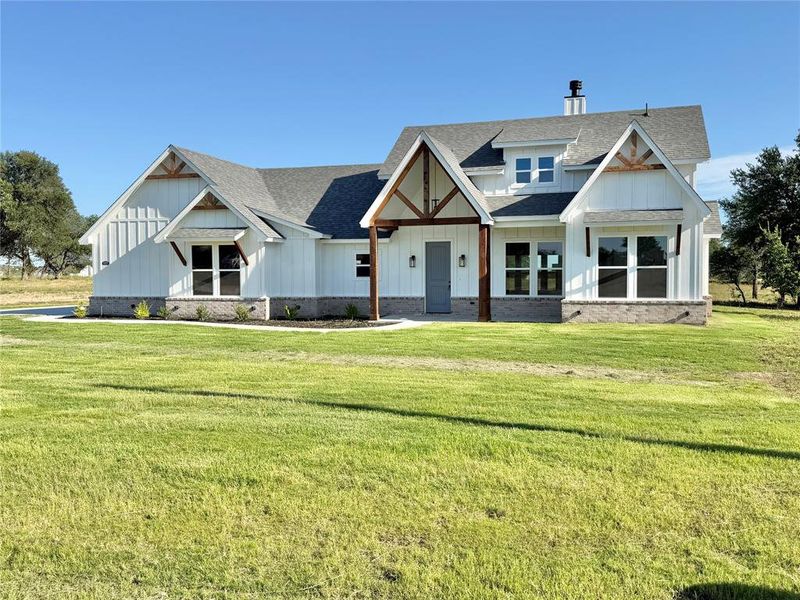 Front exterior of a new home in , Weatherford, TX, highlighting curb appeal (Image 15).