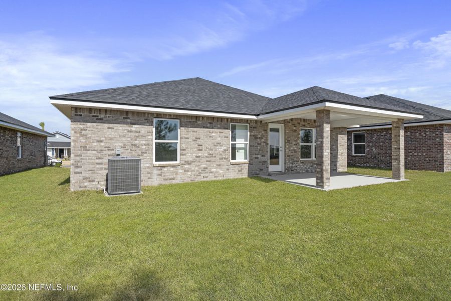 Exterior details and patio area of a home in Shadow Crest at Rolling Hills, Green Cove Springs (Image 18).