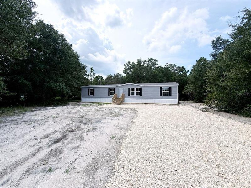 Front exterior of a new home in , Crystal River, FL, highlighting curb appeal (Image 2).