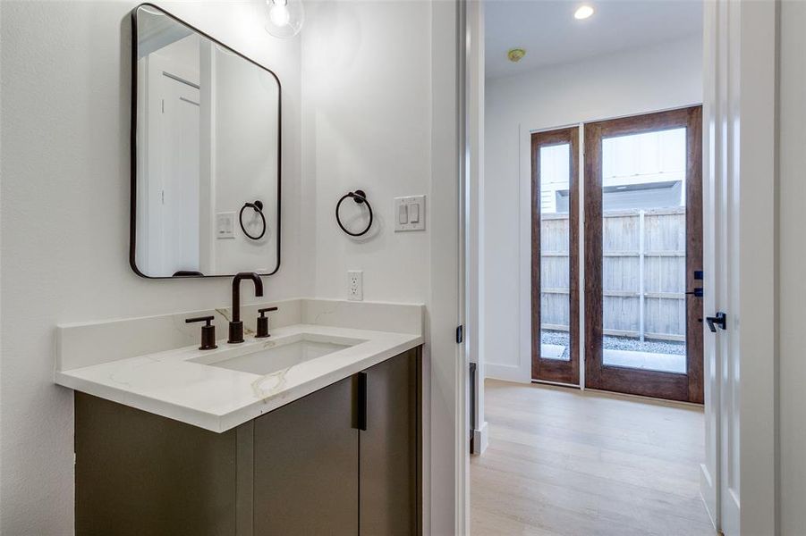 Bathroom with vanity and hardwood / wood-style floors