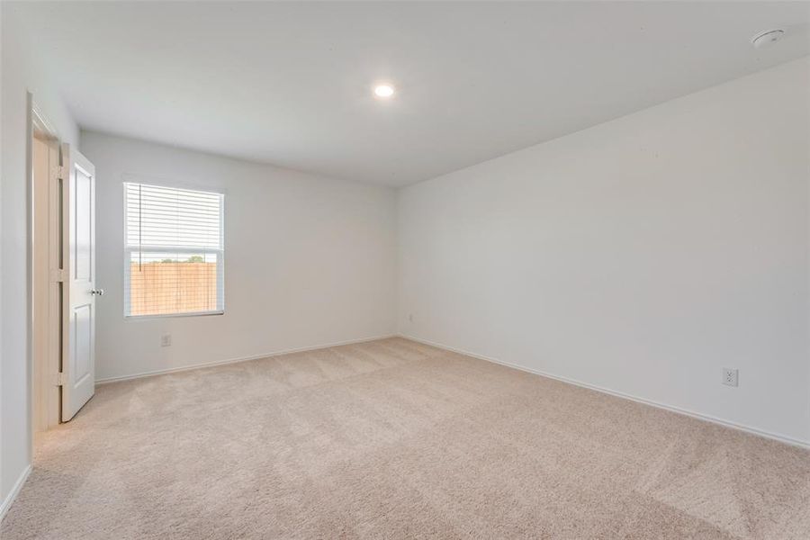 Unfurnished room featuring light colored carpet and recessed lighting Unfurnished room featuring light colored carpet and recessed lighting
