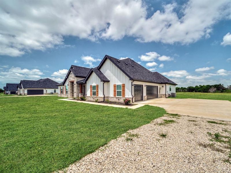 Front exterior of a new home in , Celeste, TX, highlighting curb appeal (Image 2).