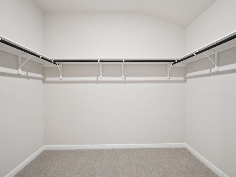 Primary suite walk-in closet in the Briscoe floorplan at a Meritage Homes community. Primary suite walk-in closet in the Briscoe floorplan at a Meritage Homes community.
