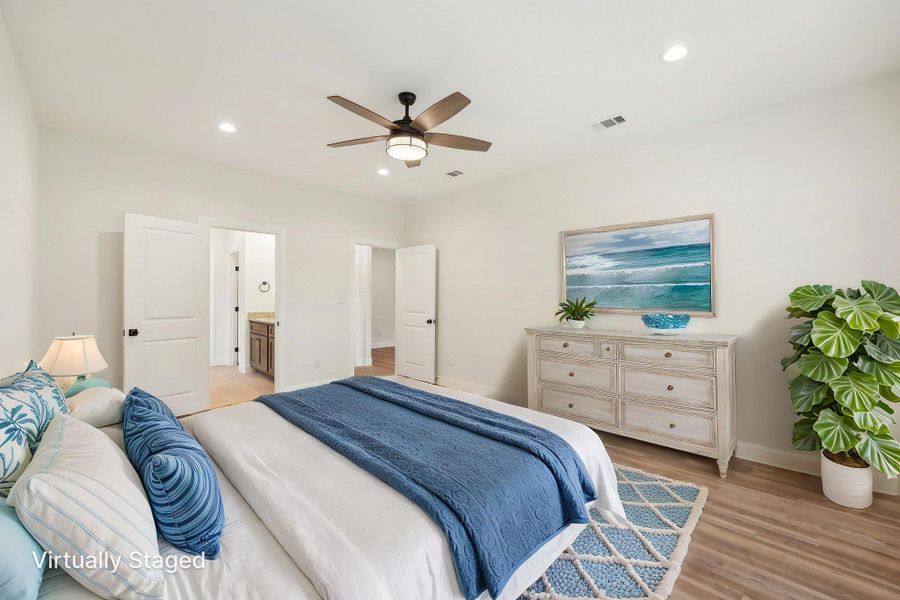 Virtually Staged Primary Bedroom with Vinyl Wood Plank floor, baseboards, visible vents, recessed lighting, and a ceiling fan Virtually Staged Primary Bedroom with Vinyl Wood Plank floor, baseboards, visible vents, recessed lighting, and a ceiling fan