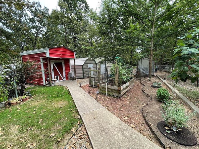 View of yard with a storage unit View of yard with a storage unit