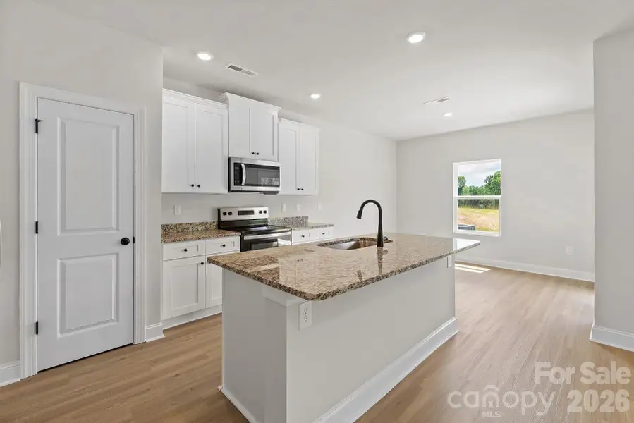 Furnished interior view inside a new home in Ascot Woods, Charlotte (Image 3).