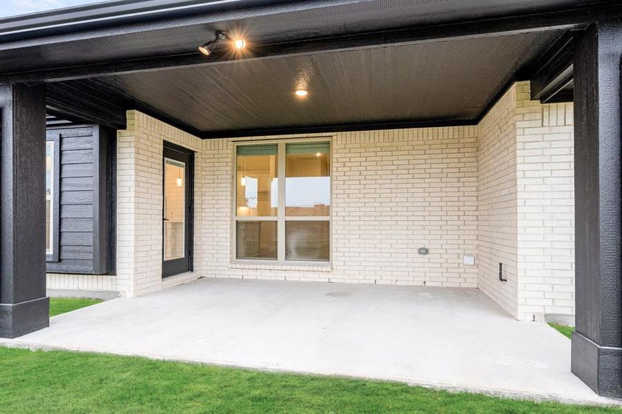 Exterior details and patio area of a home in Villages of Hurricane Creek, Anna (Image 4).