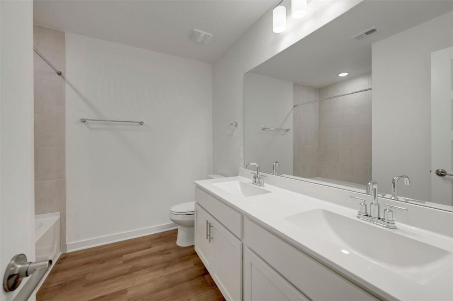 Furnished interior view inside a new home in Lone Star Landing, Montgomery (Image 8).