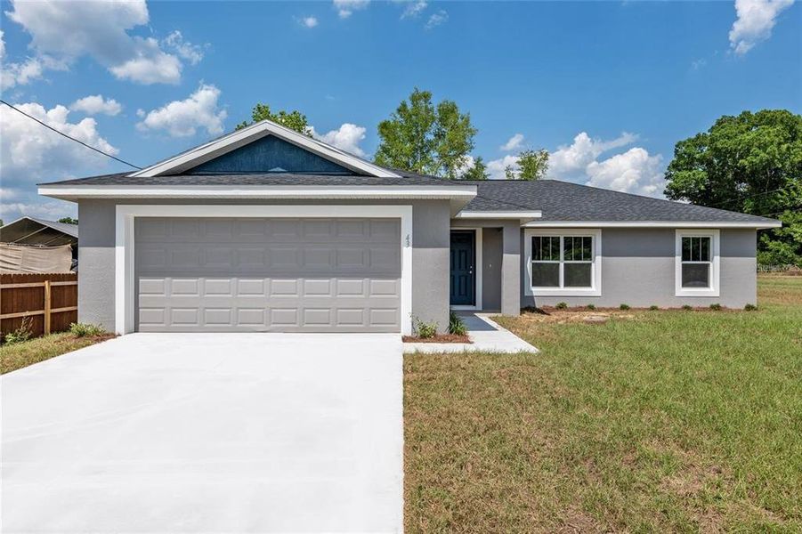 Front exterior of a new home in , Ocala, FL, highlighting curb appeal (Image 24).