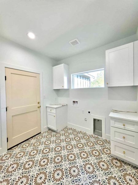 Laundry room with hookup for a washing machine, hookup for an electric dryer, gas dryer hookup, and recessed lighting