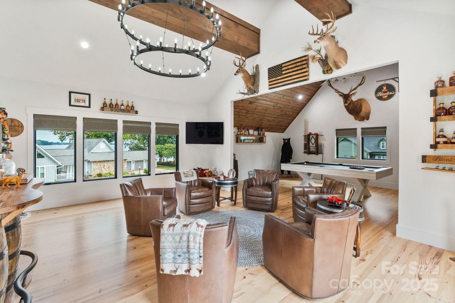 Dedicated bonus room features rustic industrial lighting and private entrance from the garage Dedicated bonus room features rustic industrial lighting and private entrance from the garage