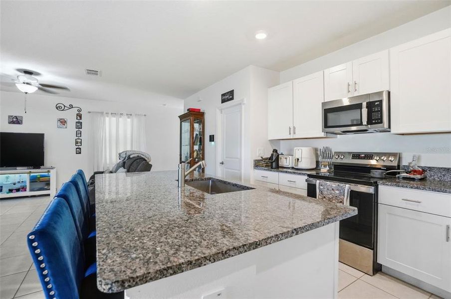 Furnished interior view inside a new home in The Isle of Avalon, Spring Hill (Image 14).