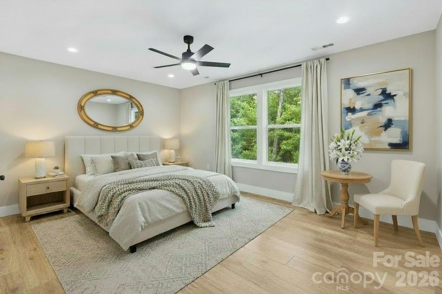 First primary suite with comfortable layout, natural light and big windows overlooking a natural, peaceful setting. First primary suite with comfortable layout, natural light and big windows overlooking a natural, peaceful setting.