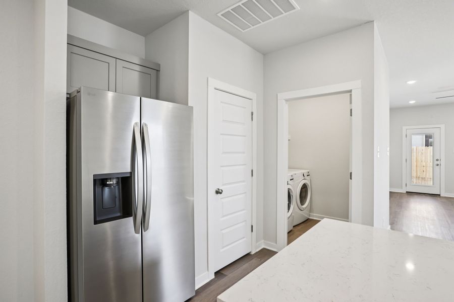 A kitchen with white cabinets. A kitchen with white cabinets.