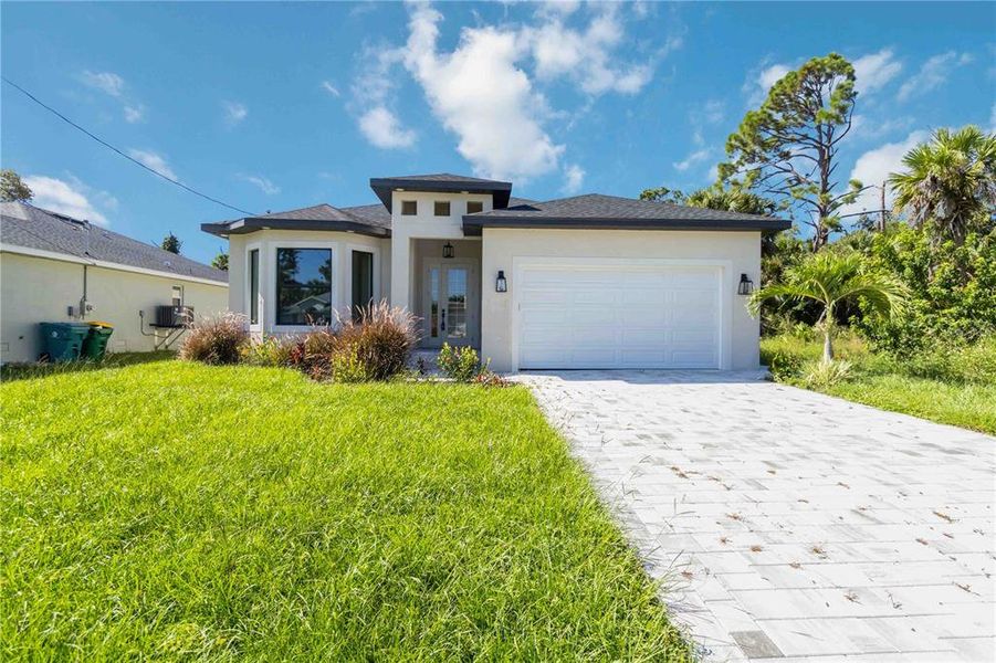 Front exterior of a new home in , Rotonda West, FL, highlighting curb appeal (Image 23).