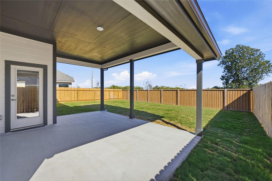 Fenced backyard with a patio Fenced backyard with a patio