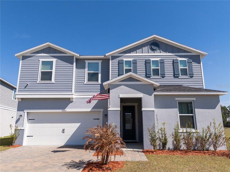 Front exterior of a new home in , Clermont, FL, highlighting curb appeal (Image 30). Front exterior of a new home in , Clermont, FL, highlighting curb appeal (Image 30).
