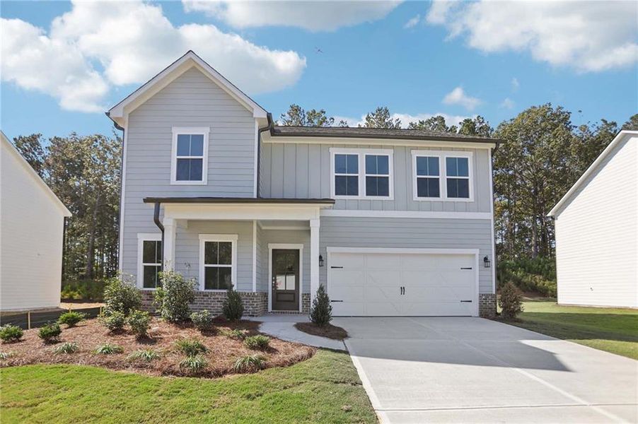 Front exterior of a new home in The Pointe at Heron Bay, Locust Grove, GA, highlighting curb appeal (Image 2).