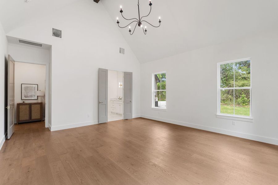 Expansive primary suite with upgraded wall insulation adding an extra layer of comfort and quiet for a more private retreat.
