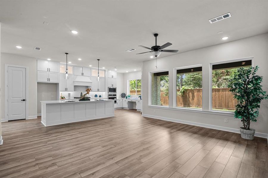 EXAMPLE PHOTO:  Big windows at Family rm that overlooks covered patio & fully sodded rear yard