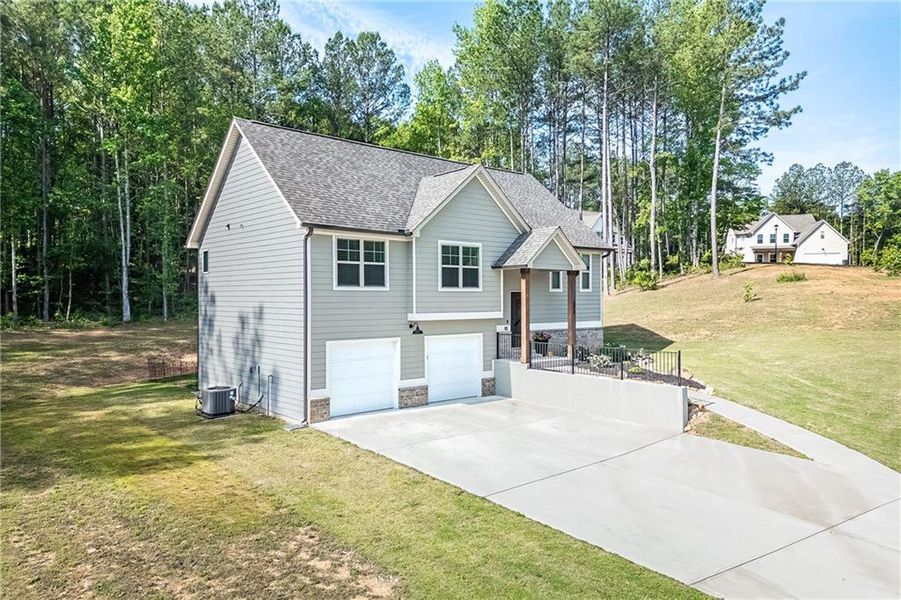 Front exterior of a new home in , Villa Rica, GA, highlighting curb appeal (Image 19). Front exterior of a new home in , Villa Rica, GA, highlighting curb appeal (Image 19).