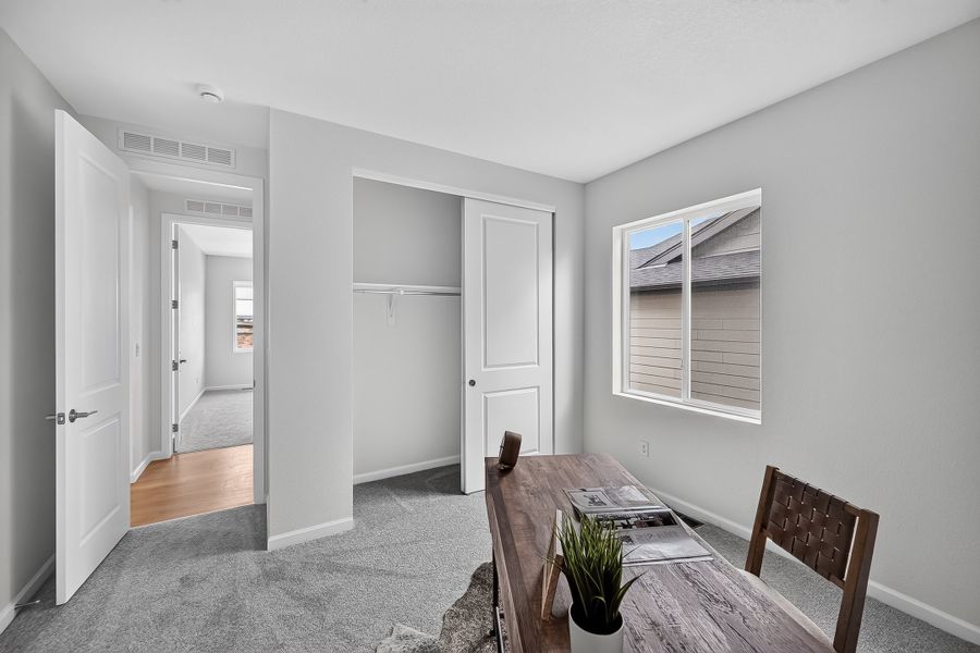 Furnished interior view inside a new home in Trailstone, Arvada (Image 14).