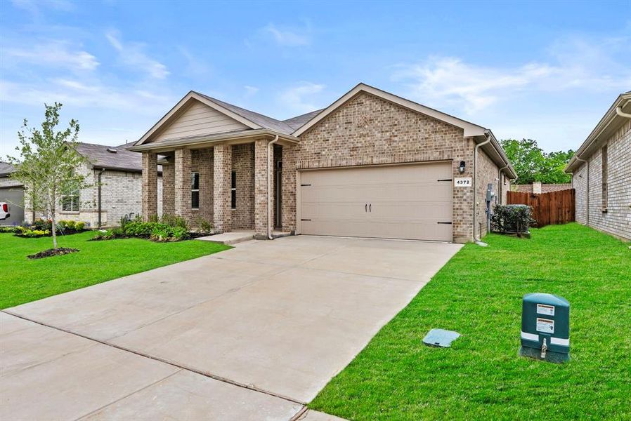 Front exterior of a new home in Terra Trace, Fort Worth, TX, highlighting curb appeal (Image 1). Front exterior of a new home in Terra Trace, Fort Worth, TX, highlighting curb appeal (Image 1).
