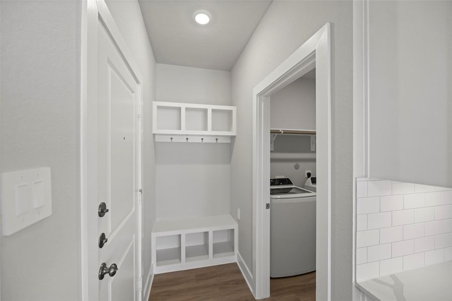 Mud room just off the garage and laundry room area which goes directly into the primary closet.