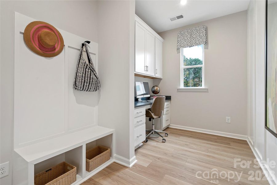 Built-in drop zone and desk space with storage.