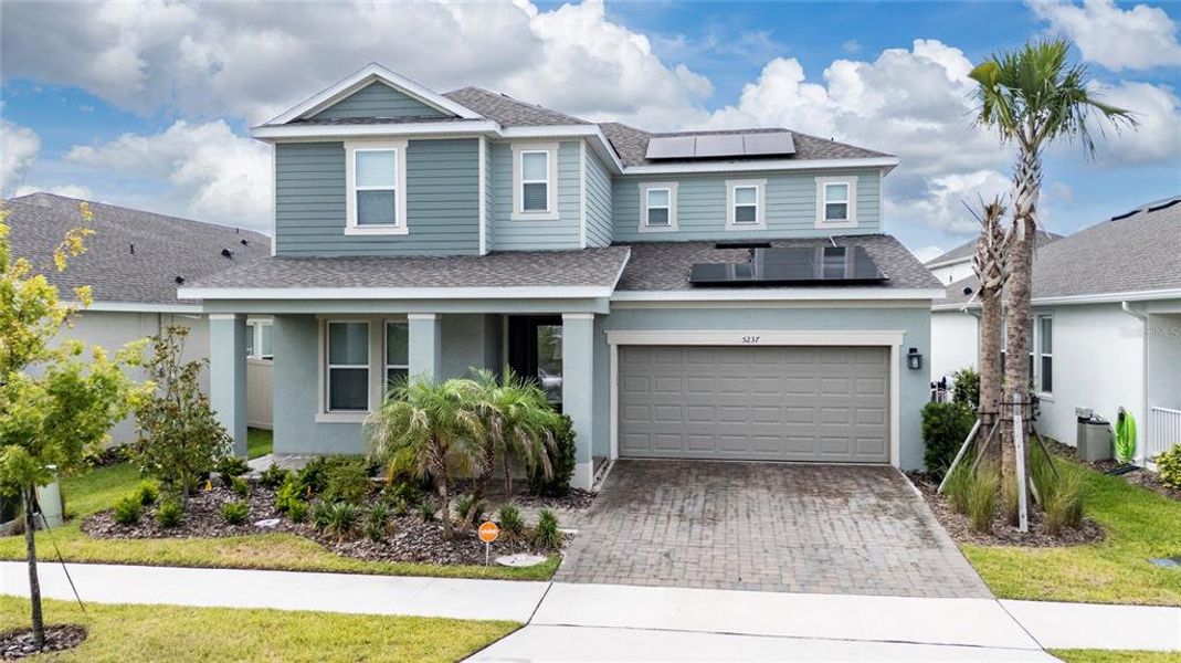 Front exterior of a new home in Center Lake Ranch Community Group Page, St. Cloud, FL, highlighting curb appeal (Image 1). Front exterior of a new home in Center Lake Ranch Community Group Page, St. Cloud, FL, highlighting curb appeal (Image 1).