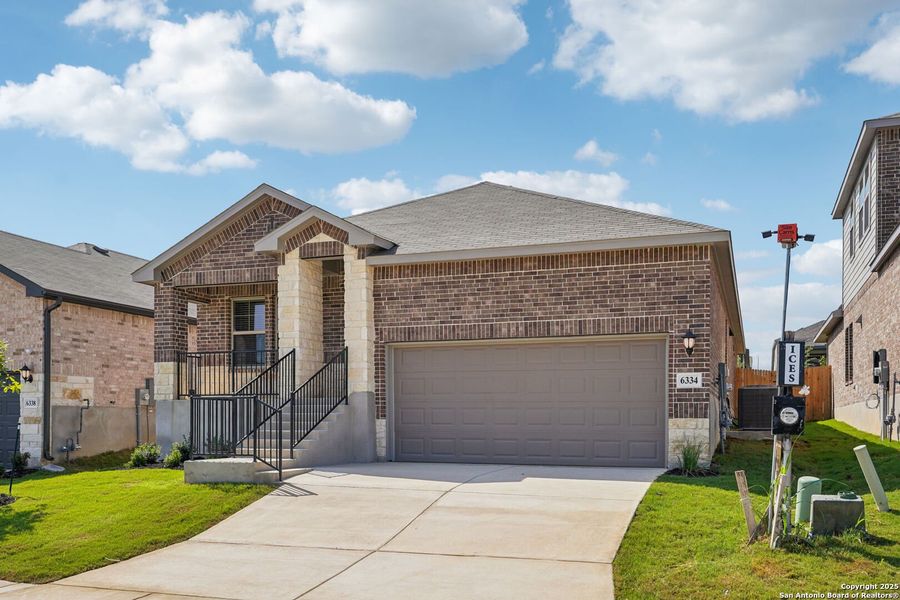 Front exterior of a new home in Comanche Ridge, San Antonio, TX, highlighting curb appeal (Image 2).