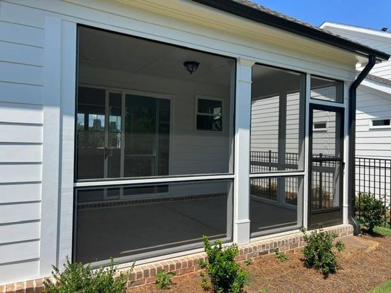 Exterior details and patio area of a home in Promenade at Sawnee Village, Cumming (Image 3).