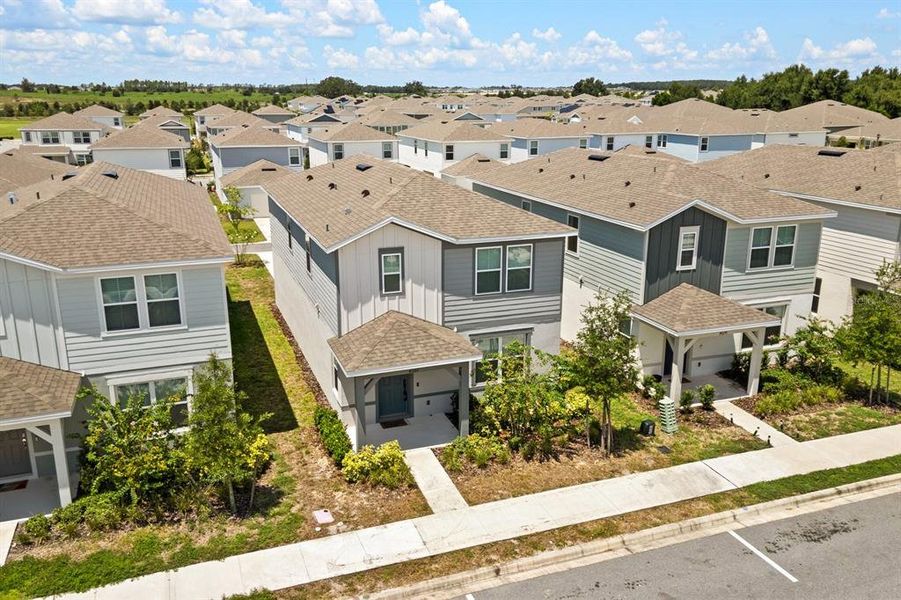 Front exterior of a new home in , Apopka, FL, highlighting curb appeal (Image 1).