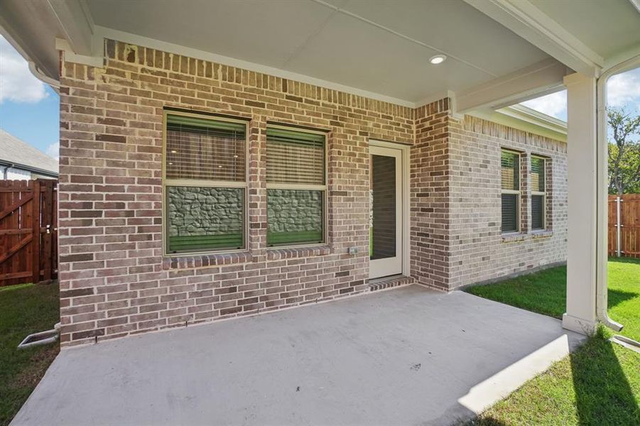 Exterior details and patio area of a home in Eastridge - Spring Series, McKinney (Image 22). Exterior details and patio area of a home in Eastridge - Spring Series, McKinney (Image 22).