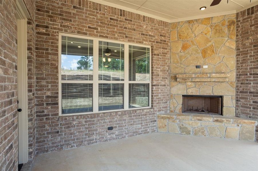 View of patio / terrace with an outdoor stone fireplace