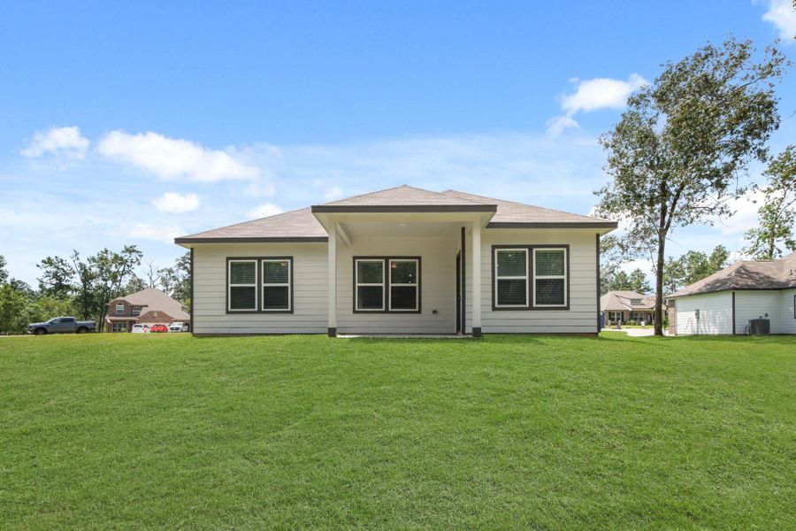 Exterior details and patio area of a home in Oakwood Ranch, Willis (Image 21). Exterior details and patio area of a home in Oakwood Ranch, Willis (Image 21).