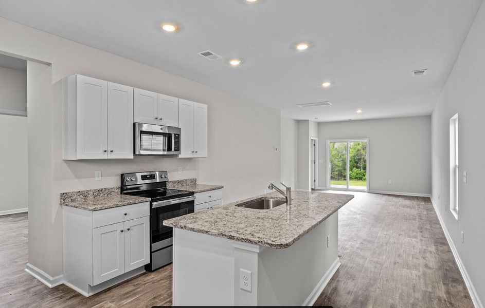 Furnished interior view inside a new home in Lindera Preserve at Cane Bay Plantation: American Dream Series - Ph 15, Summerville (Image 5). Furnished interior view inside a new home in Lindera Preserve at Cane Bay Plantation: American Dream Series - Ph 15, Summerville (Image 5).