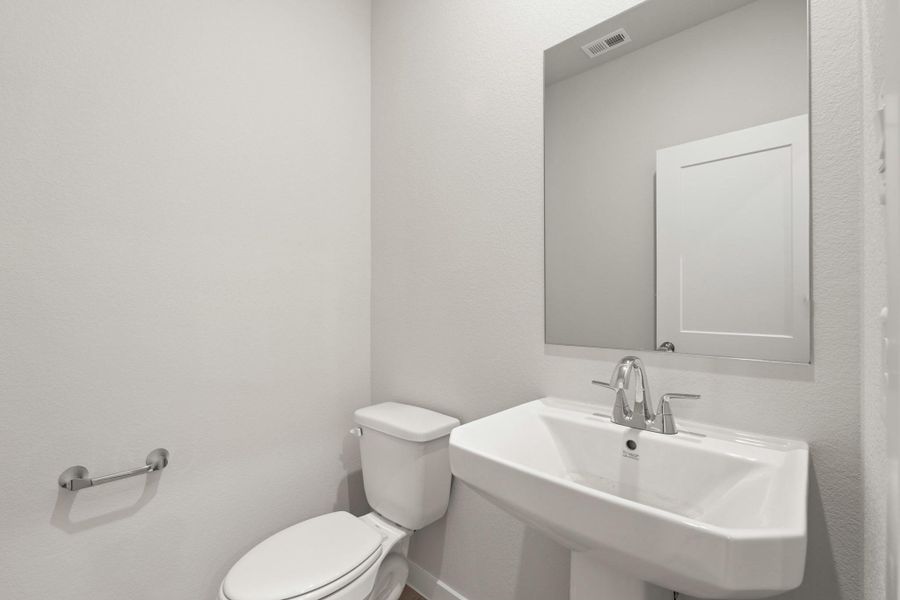 Furnished interior view inside a new home in Sunterra, Katy (Image 4).