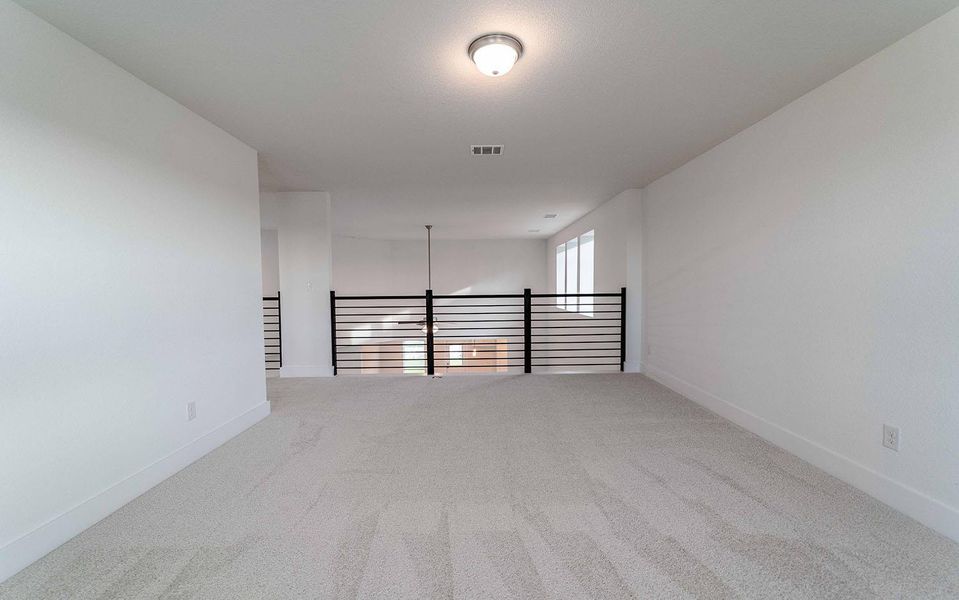 Unfurnished room featuring light carpet and baseboards Unfurnished room featuring light carpet and baseboards
