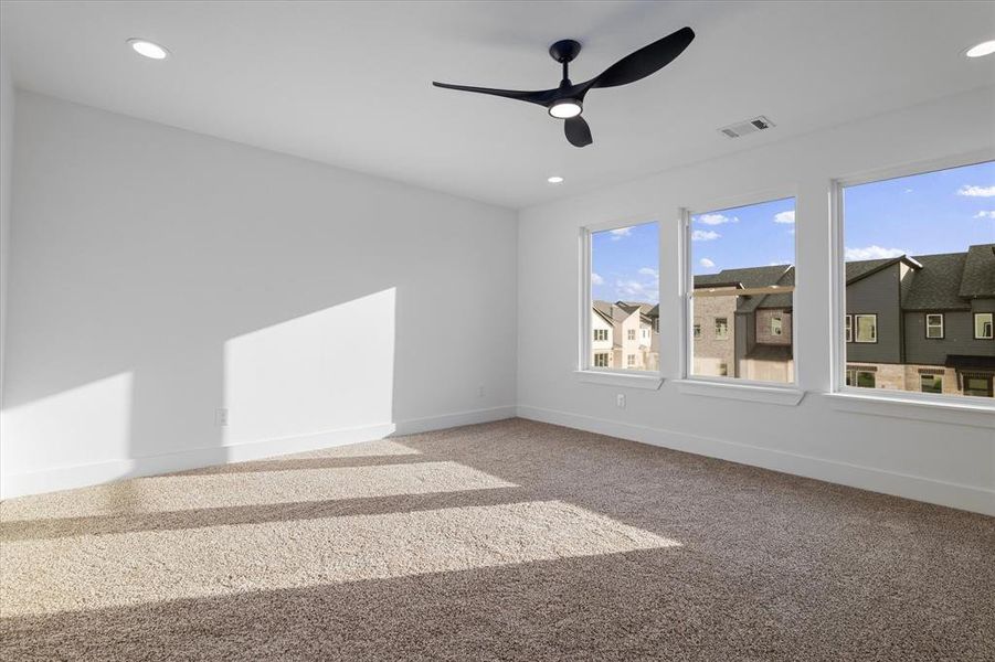 Empty room featuring carpet flooring, recessed lighting, and ceiling fan Empty room featuring carpet flooring, recessed lighting, and ceiling fan
