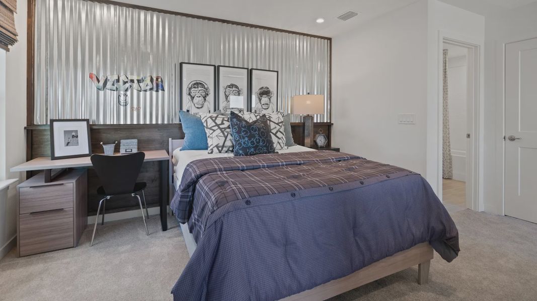 Above garage retreat space bedroom in a DRB Homes Ambersweet model at the Trinity Place community. Above garage retreat space bedroom in a DRB Homes Ambersweet model at the Trinity Place community.