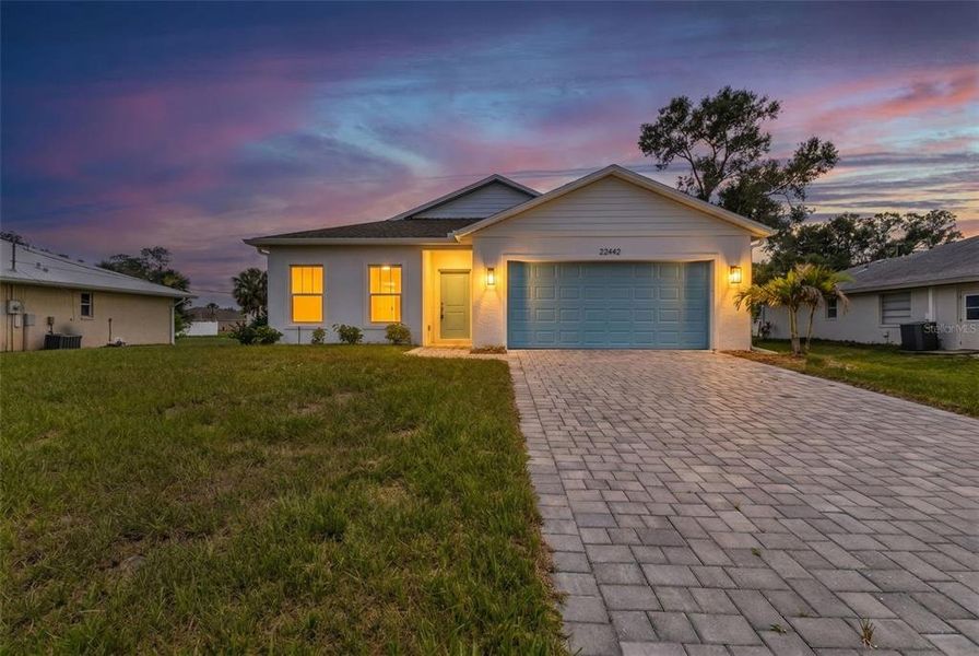 Front exterior of a new home in , Port Charlotte, FL, highlighting curb appeal (Image 2). Front exterior of a new home in , Port Charlotte, FL, highlighting curb appeal (Image 2).