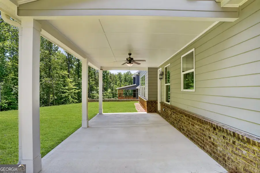 Exterior details and patio area of a home in The Manor at Gainesville Township, Gainesville (Image 4).
