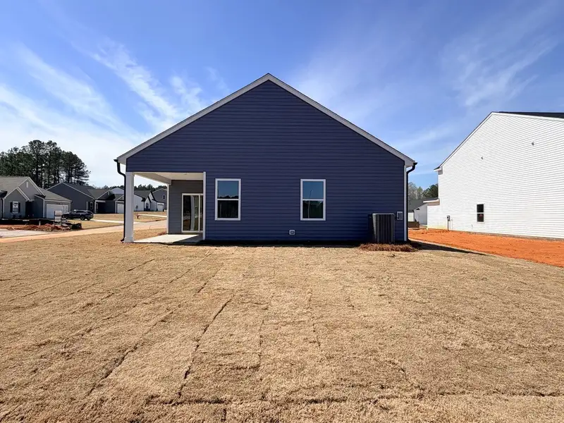 Exterior details and patio area of a home in Middleton Farms, Middlesex (Image 3).