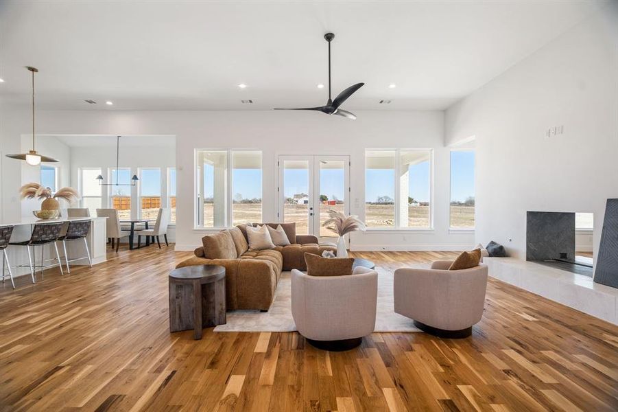 Living room with light hardwood / wood-style flooring and french doors