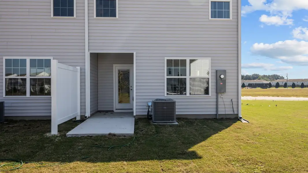 Exterior details and patio area of a home in The Townes at Ridgewood Farms, Winterville (Image 3).