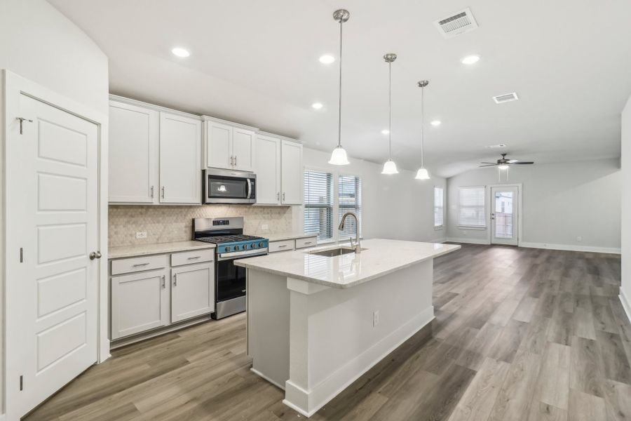 Kitchen in the Hughes floorplan at a Meritage Homes community.