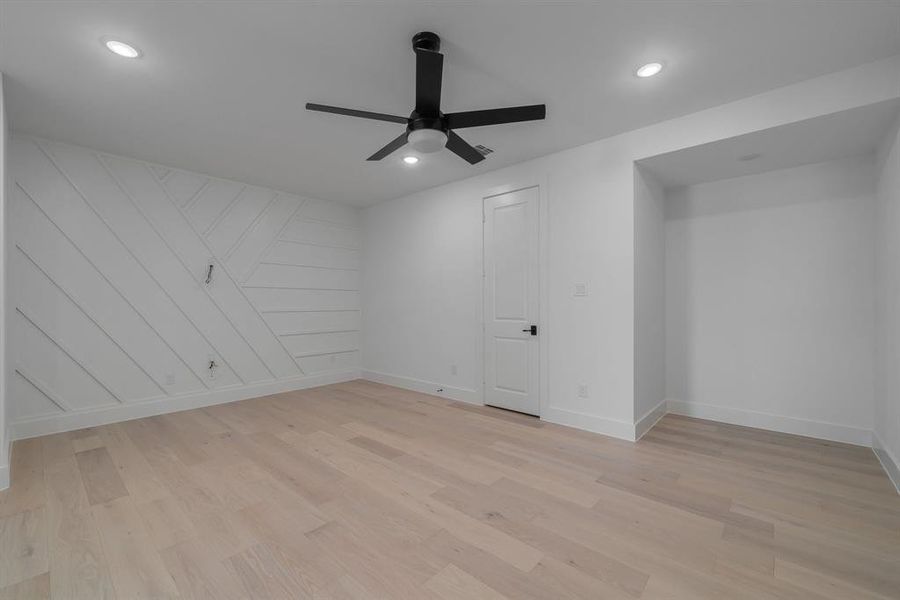 Spare room featuring ceiling fan and light hardwood / wood-style flooring