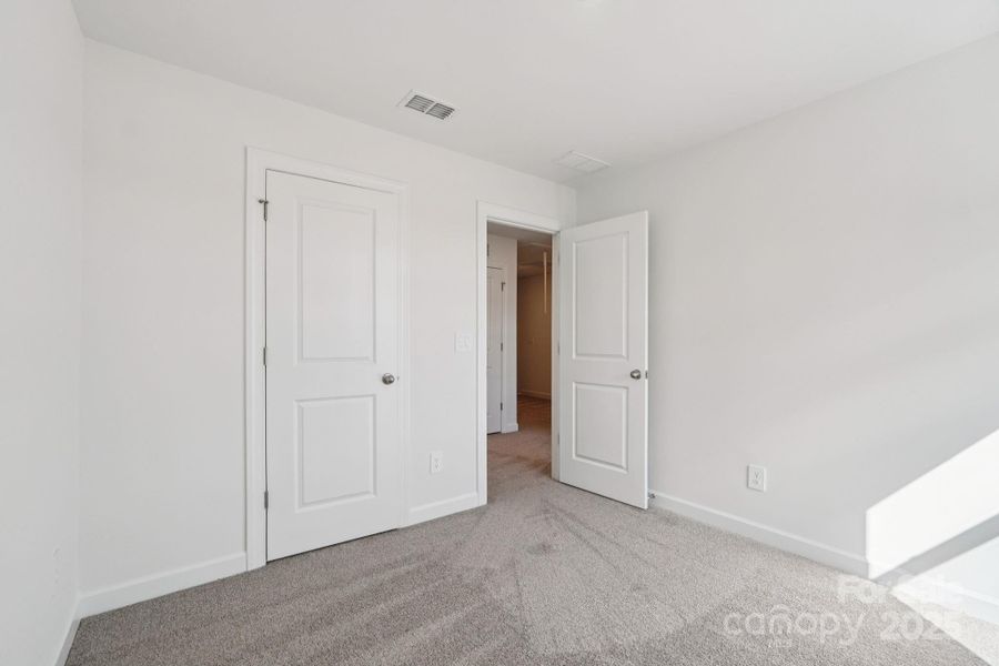 Spacious, unfurnished interior of a new home in Meadows at Wilson Farms - The Heights Series, Fort Mill (Image 27). Spacious, unfurnished interior of a new home in Meadows at Wilson Farms - The Heights Series, Fort Mill (Image 27).