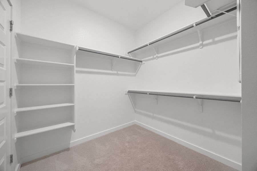 Primary Closet in the Sabine home plan by Trophy Signature Homes – REPRESENTATIVE PHOTO Primary Closet in the Sabine home plan by Trophy Signature Homes – REPRESENTATIVE PHOTO